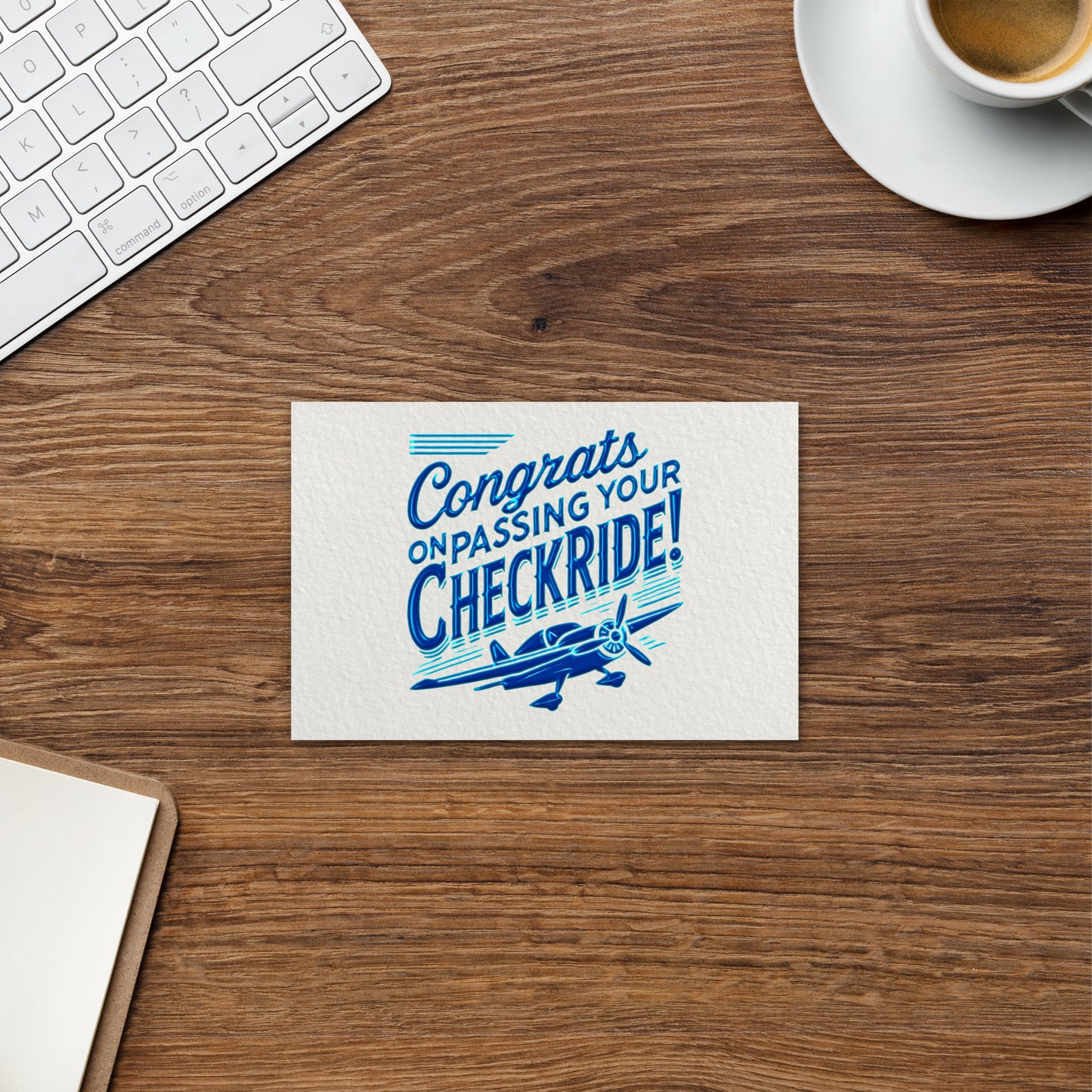 'Congrats on passing your checkride!' text and airplane graphic postcard.