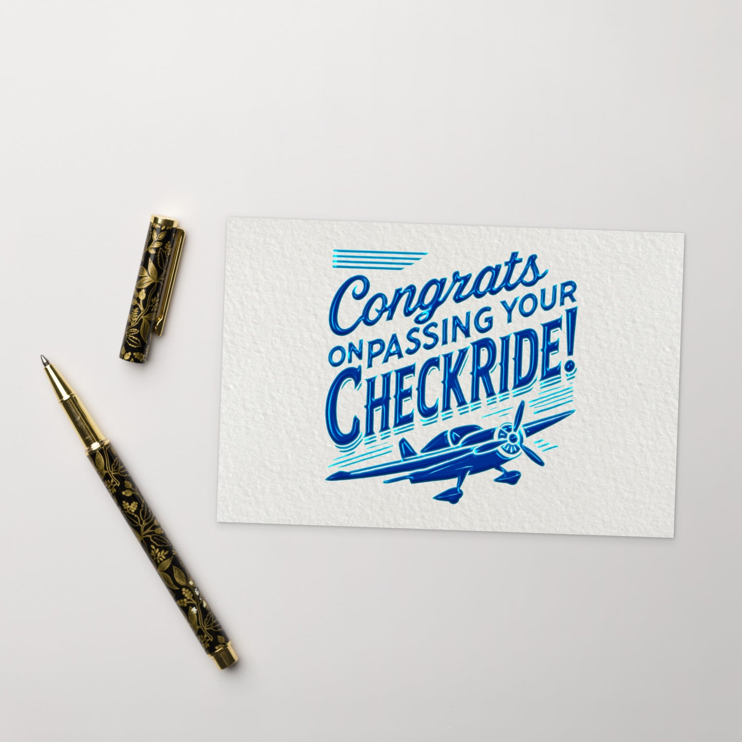 'Congrats on passing your checkride!' text and airplane graphic postcard.