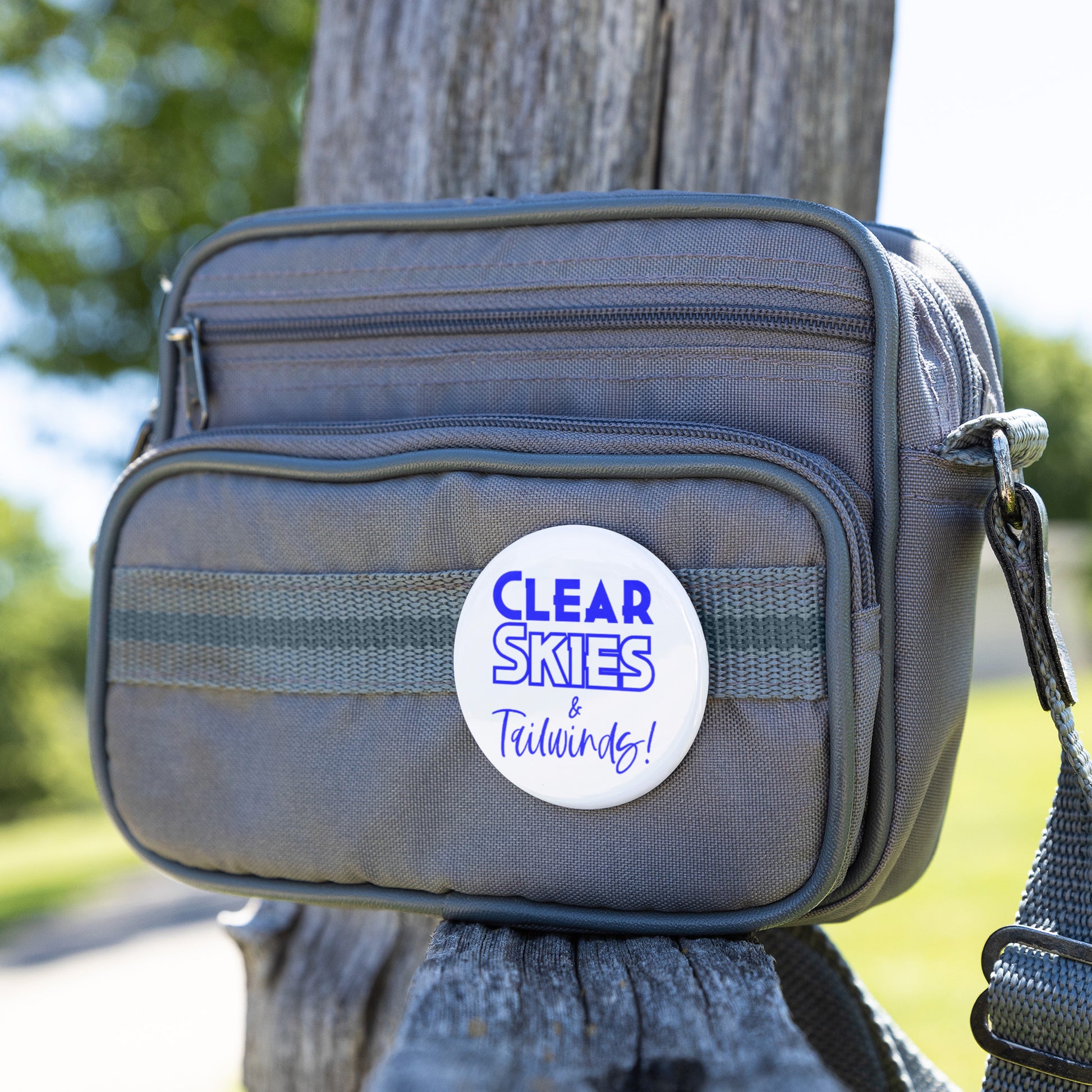 Clear skies & tailwinds! button pin (blue)
