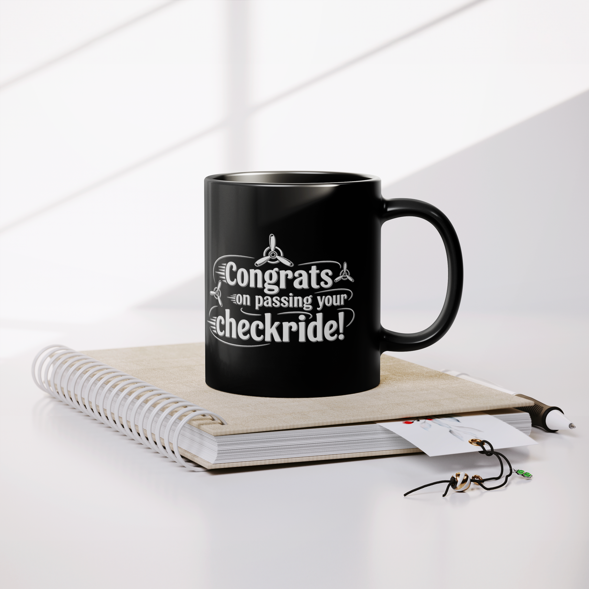 Congrats_on_passing_your_checkride_v3_Lifestyle_Notebook_Mockup.png
