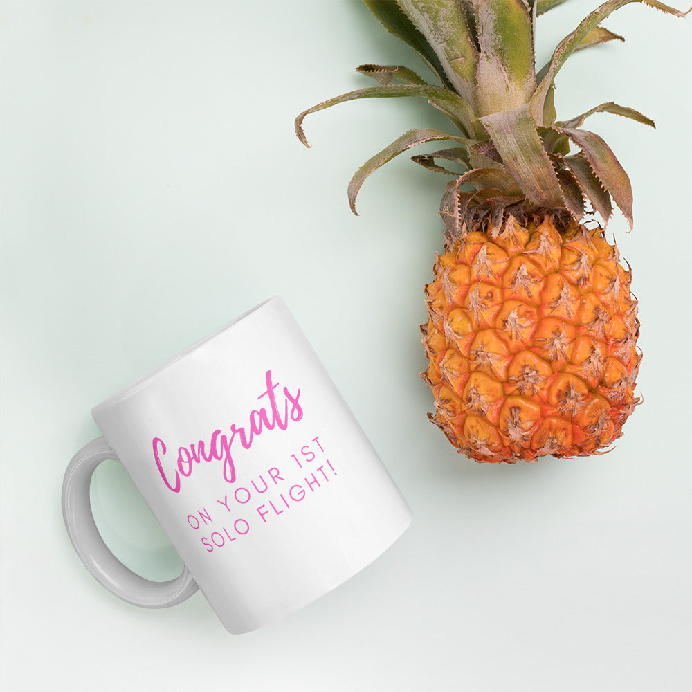 Congrats on your 1st solo flight - white glossy 11oz mug with pink text